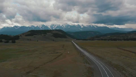 Drone flight over asphalt highway road and mountains on background Stock Footage 200780520