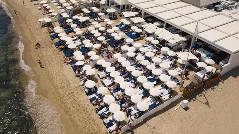 Drone flight over beach club in St. Tropez 스톡 동영상 101650341