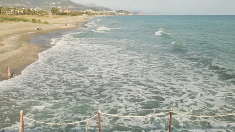 Drone flight over the beach shore of the Mediterranean Sea of the Turkish resort Video stock 194683090