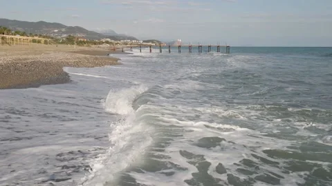 Drone flight over the beach shore of the Mediterranean Sea of the Turkish resort Stock Footage 194683420
