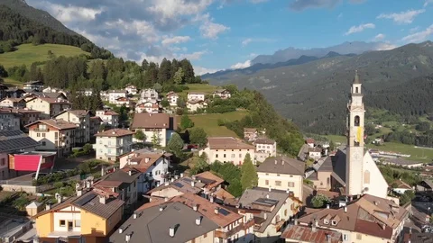 Drone flight over a beautiful alpine viallge Stock Footage 112332549