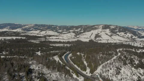 Drone flight over the beautiful landscape of the road in the mountains covered Stock Footage 149485652