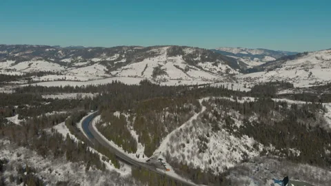 Drone flight over the beautiful landscape of the road in the mountains covered Stock Footage 149729384