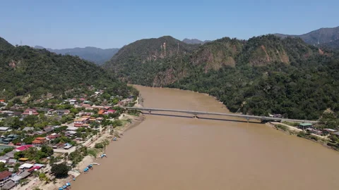 Drone Flight over Beni River Approaching the Bridge in Rurrenabaque, Bolivia Vídeo Stock 331740675