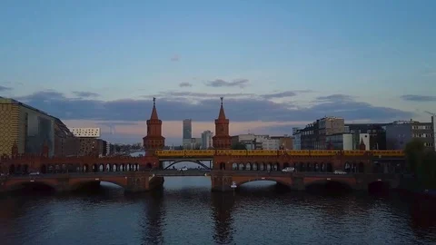 Drone flight over Berlin with train passing in background 스톡 동영상 101651147