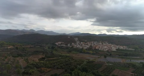 Drone flight over blue glazed roofs of a typical town in Castellón Stock Footage 214761397