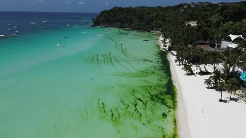 Drone flight over Boracay beach crystal clear water tropical island Philippi Stock Footage 333582396