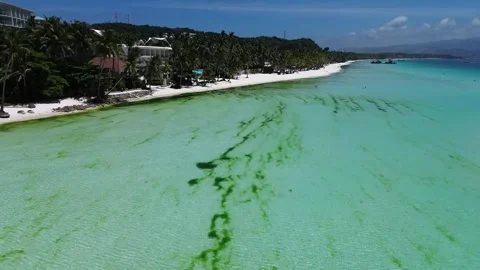 Drone flight over Boracay beach crystal clear water tropical island Philippi Stock Footage 333582398