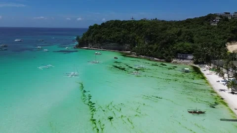 Drone flight over Boracay beach crystal clear water tropical island Philippi Stock Footage 333582404