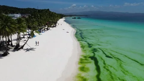 Drone flight over Boracay beach crystal clear water tropical island Philippi Stock Footage 333582405
