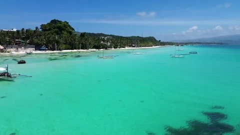 Drone flight over Boracay beach crystal clear water tropical island Philippi Stock Footage 333582412