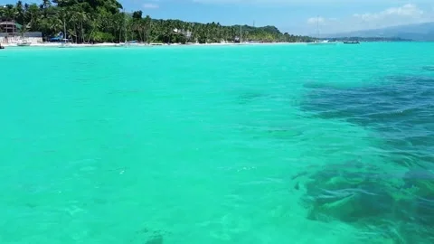 Drone flight over Boracay beach crystal clear water tropical island Philippi Stock Footage 333582435