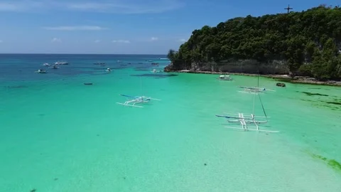 Drone flight over Boracay beach crystal clear water tropical island Philippi Stock Footage 333582466