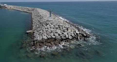 Drone flight over breakwater of nautical port in the Mediterranean Sea Stock Footage 88105658