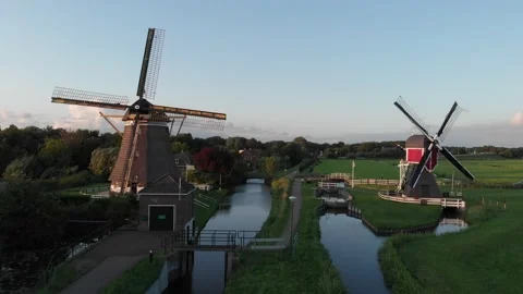 Drone flight over a bridge in a Dutch village in the evening. Stock Footage 174677410