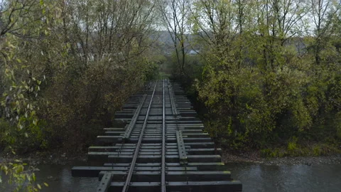 Drone flight over bridge of old narrow gauge railway Stock Footage 206050993