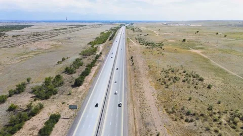 A drone flight over a busy highway in the steppe Stock Footage 135501227