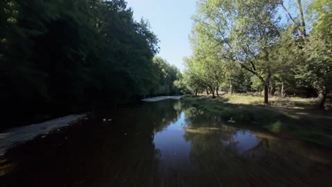 Drone flight over calm reflective section of Gradac river Stock Footage 346201840
