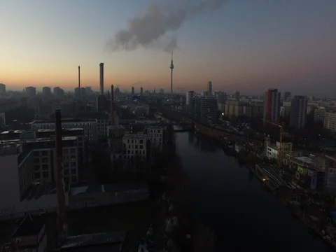 A drone flight over central Berlin during sunset at the river, aerial. Stock Footage