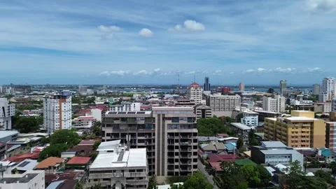 Drone flight over central Cebu City with modern buildings and cityscape 170 Stock Footage 334936218