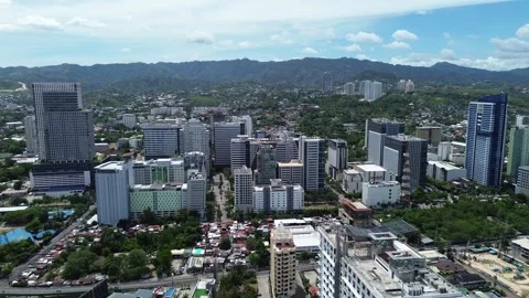 Drone flight over central Cebu City with modern buildings and cityscape 171 Stock-Footage 334936376