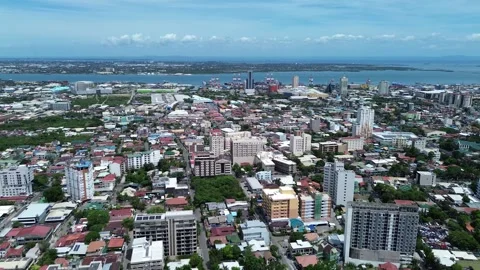 Drone flight over central Cebu City with modern buildings and cityscape 172 Stock Footage 334936380