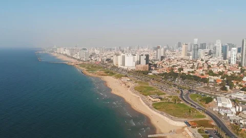 Drone flight over the city beach of tel Aviv. Beautiful summer city view from Stock Footage 100178969