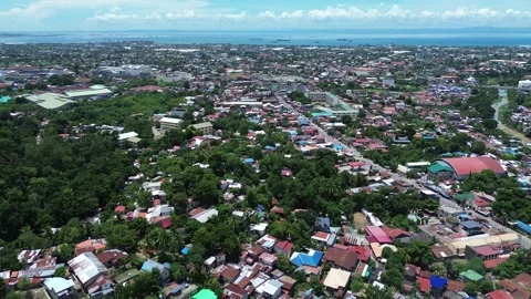 Drone flight over city buildings and neighborhood in Talisay Cebu 134 Stock Footage 334722409