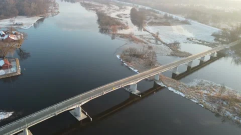 Drone flight over the city, river and bridges on a sunny winter day. Stock Footage 168517310