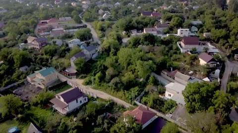 Drone flight over the city at sunset Stock Footage 158816406