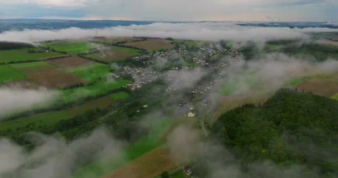 Drone flight over clouds and green fresh forest in hilly Europe, Germany. Aerial Stock Footage 252427380