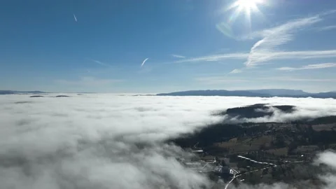 Drone flight over the clouds during sunrise. Fly through the clouds. Fresh Stock Footage 228714577