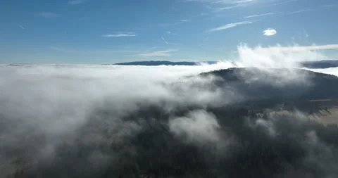Drone flight over the clouds during sunrise. Fly through the clouds. Fresh Stock Footage 228715723