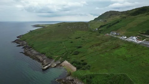 Drone flight over coastal hills and houses in Donegal, Ireland Stock Footage 346745871