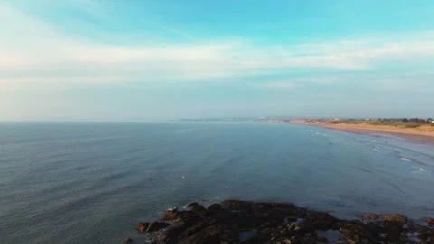 Drone flight over coastal rocks to irish sea morning Stock Footage 311949628