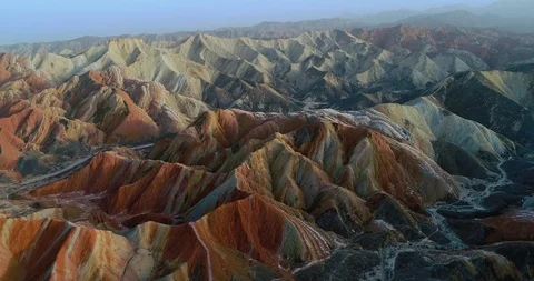 Drone flight over colorful Rainbow Mountains in Zhangye Stock Footage 87644438