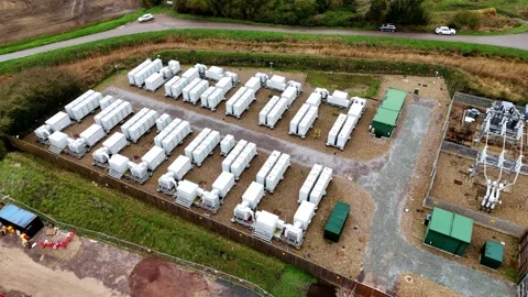 Drone flight over compact BESS container arrays for renewable energy resilience Stock-Footage 340268163
