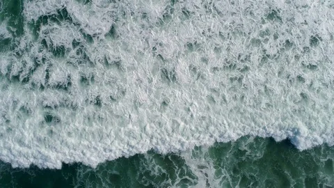 Drone flight over constant tropical sea swell Stock Footage 98639997