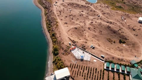 Drone flight over a cottages on the shore of lake Stock Footage 226701078