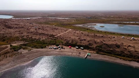 Drone flight over a cottages on the shore of lake Stock Footage 230775290