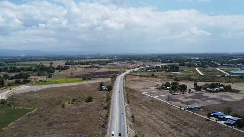 Drone Flight Over Countryside Road and Farmland in Bulacan Philippines Stock Footage 319844948