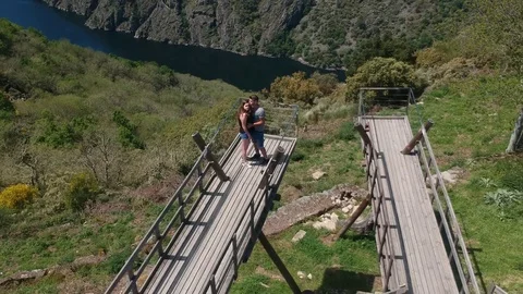 Drone flight over a couple on the Sil River viewpoint Stock Footage 123216959