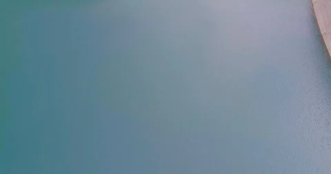 Drone flight over a dam in Emosson Stock Footage 102570886