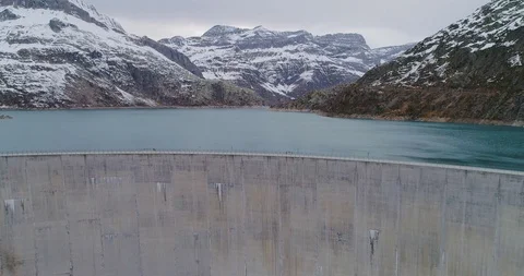 Drone flight over a dam in Emosson Stock Footage 102570988