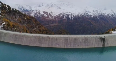 Drone flight over a dam in Emosson Stock Footage 102571275
