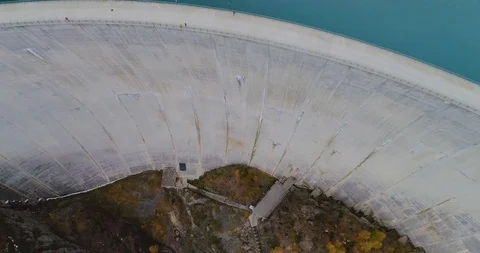 Drone flight over a dam in Emosson Stock Footage 102571313