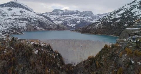 Drone flight over a dam in Emosson Stock Footage 102571626