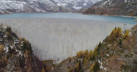Drone flight over a dam in Emosson Stock Footage 102571849
