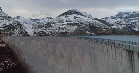Drone flight over a dam in Emosson Stock Footage 102571946