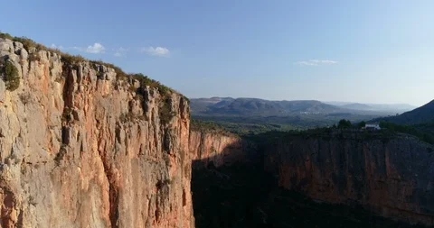 Drone flight over deep cliffs in mountains and forests Stock Footage 124220841